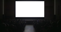 People in the auditorium with chroma key screen