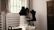 a woman making a dress 