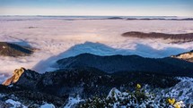 Low Foggy clouds in beautiful nature landscape in shadow of alpine peak mountain Time lapse
