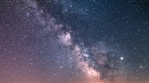 Milky Way Galaxy Astronomy Background of deep universe at starry night sky with millions of stars Time-Lapse Night to day
