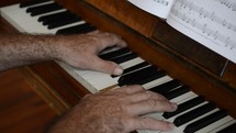 a man playing a piano 