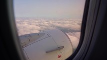 Sunset and Journey from the Airplane Window. Plane Flights Over Fluffy Clouds. Passenger window panorama view.