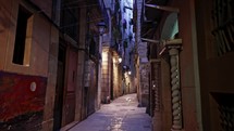 Cityscape of ancient apartment buildings with balconies in old part of Barcelona - Gothic Quarter, Born district. Steadicam shot of walking person. Popular travel destination. High quality 4k footage