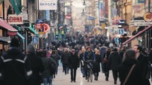 pedestrians on a crowded city sidewalk