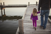 Father and daughter on boardwalk