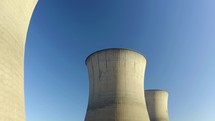 Large coal fired power station with cooling towers, chimney and boiler house. Nuclear power plant. 