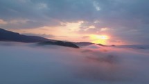 Aerial colors of sunrise above clouds
