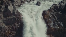 rushing water over a waterfall 