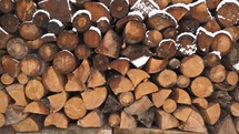 Firewood background Fire wood stacked prepared for winter season heat energy
