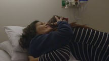 woman visiting her sick mother in the hospital 