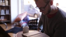 man reading a Bible with coffee 