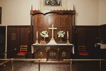 A Church altar with Cross and candles