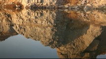 rock cliffs around a lake 