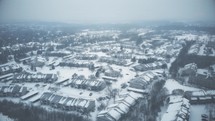homes with snow on rooftops 