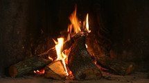 burning logs in a fireplace 