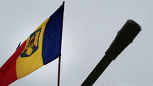 Romanian flag with the silhouette of an old cannon. Memorial Day concept.