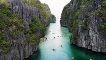 Kayakers in a lagoon in the Philippines