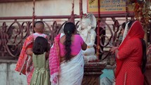 Hindus worshiping a Hindu idol god at the Taraknath Temple in Kolkata, India.