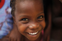 Little girl smiling.
