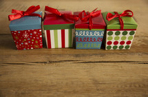 row of wrapped Christmas gifts 