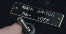 Macro shot of antique electrical switchboard with switches, lights and knobs