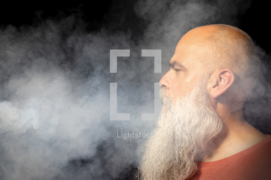 bearded man in smoke 