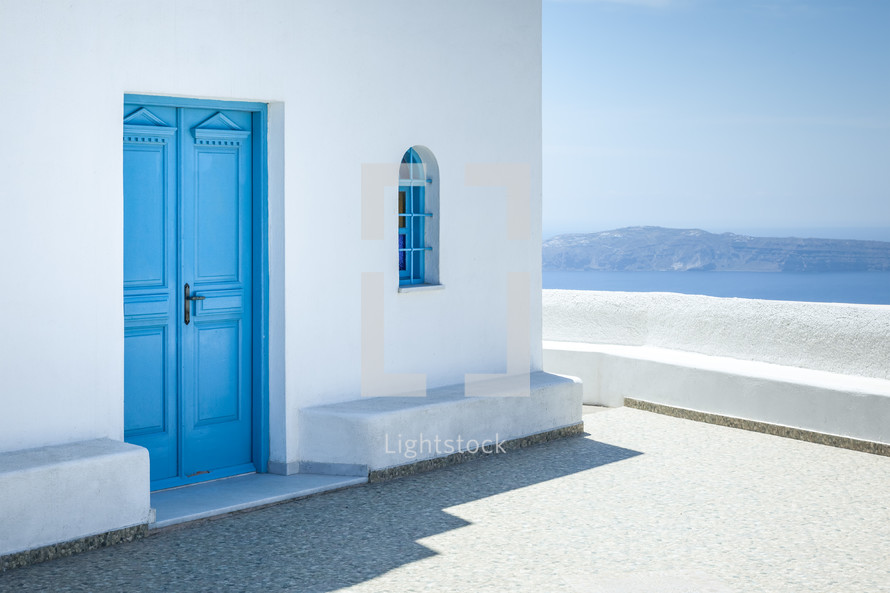 blue doors to a church in Santorini 