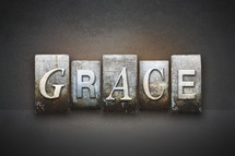 Stone tiles spelling the word GRACE.
