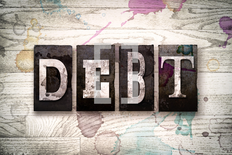 word debt on wood background 