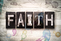 word faith on white washed wood