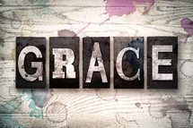 word grace on white washed wood