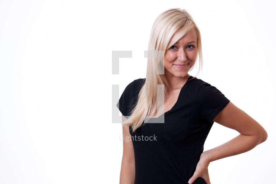 sassy portrait of a young woman with her hand on her hip 