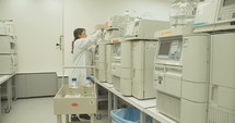Scientist working with mass spectrometer in a pharmaceutical laboratory conducting experiments