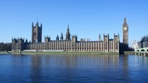 Timelapse of Big Ben and houses of the Parliament and the River Thames during the day