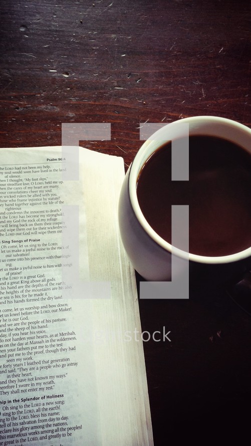 an open Bible and coffee mug