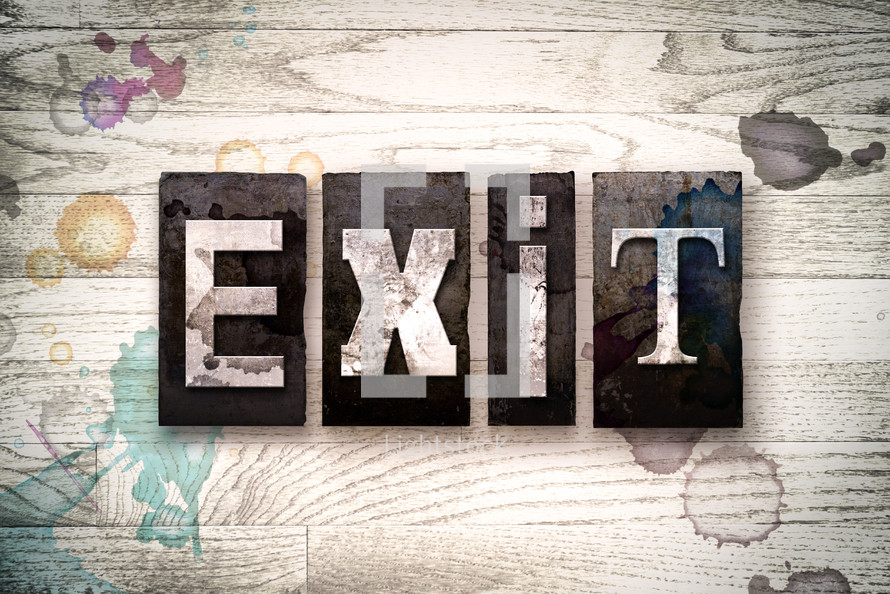 word exit on wood background 
