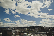 Billowing clouds in a blue sky over the city