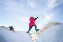 a girl playing in snow 