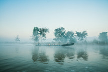 boat on a foggy river 
