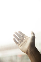a hand reaching toward heaven 