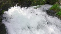 Clear Water splash in mountain stream cascade waterfall Slow motion
