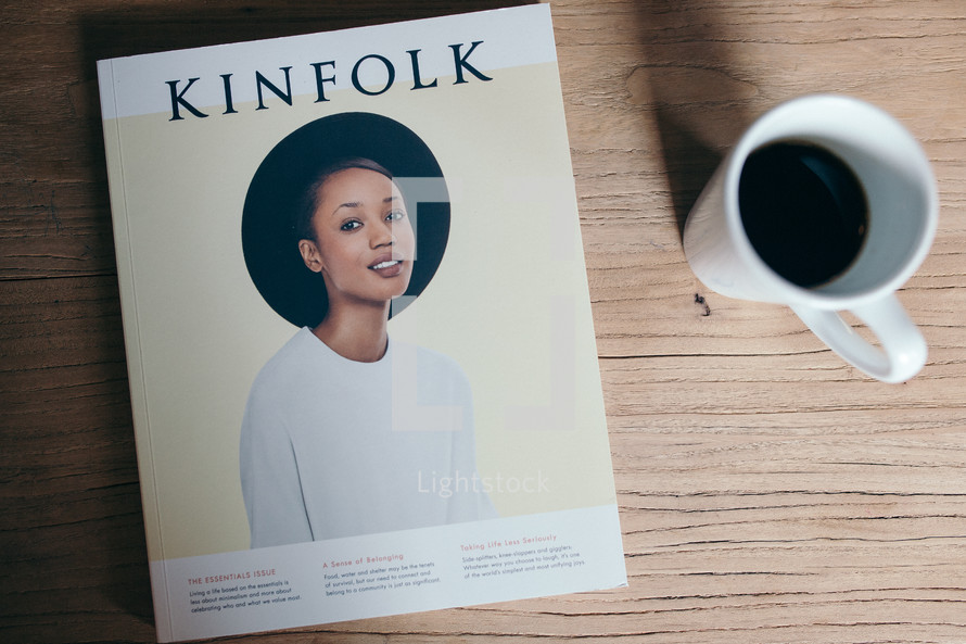 Kinfolk book and coffee in a mug on a coffee table 