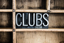 word clubs in blocks on a shelf 