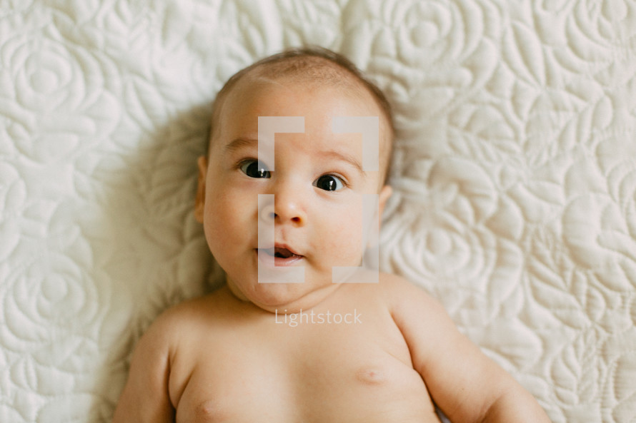 head shot of an infant lying down 