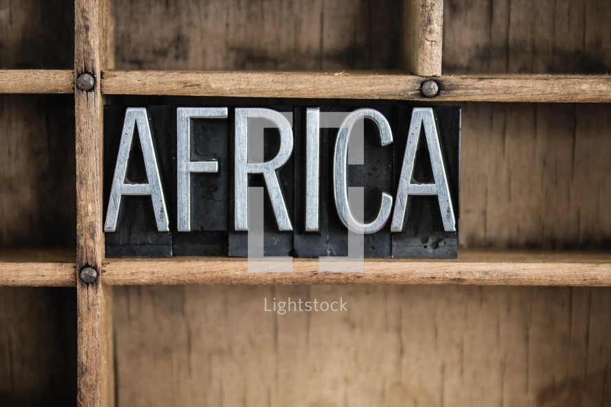 word Africa in blocks on a bookshelf 