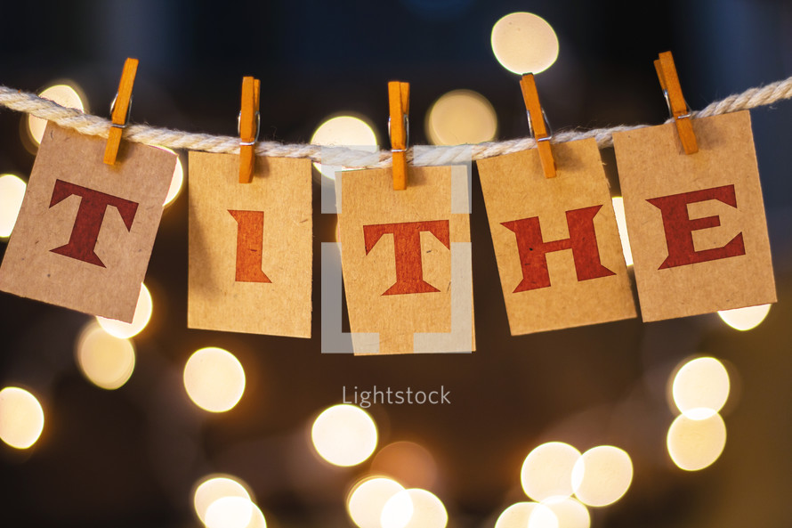 word tithe hanging on clothes pins 