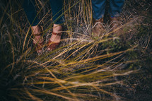 feet in tall grass and weeds 
