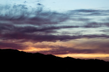 Silhouette of a mountain at sunset.