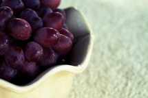 A bowl of red grapes
