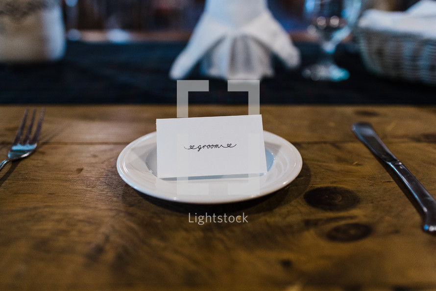 groom place card at a wedding reception 